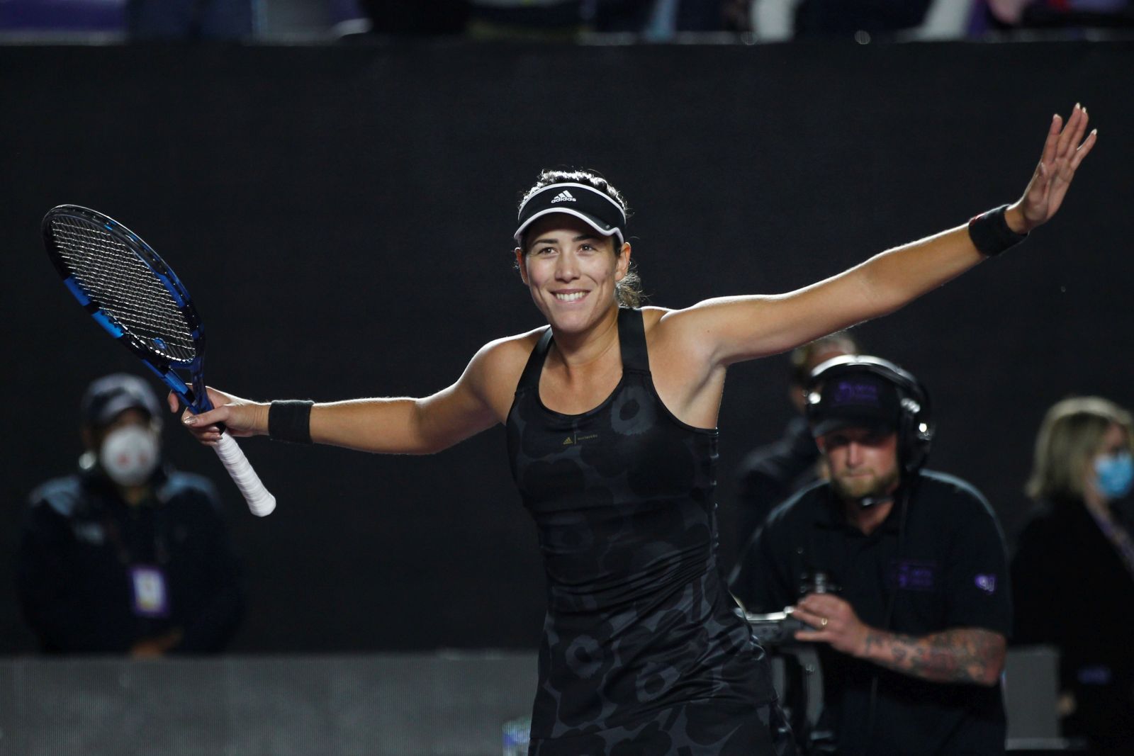 epa09582732 Spanish tennis player Garbine Muguruza of Spain celebrates her win against Anett Kontaveit of Estonia, during a match at the AKRON WTA Finals tournament, in Guadalajara, Mexico, 14 November 2021.  EPA/Francisco Guasco