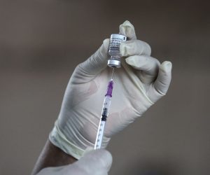 epa09586981 A health worker holds a vial of the Pfizer- BioNTech Comirnaty Covid-19 vaccine at a temporary vaccination clinic in Colombo, Sri Lanka, 17 November 2021. Sri Lankan health authorities started to administer the booster dose to senior citizens on 17 November 2021. The country is currently administering Pfizer-BioNTech, Oxford AstraZeneca, China's Sinopharm, Russian Sputnik V, and Moderna vaccines.  EPA/CHAMILA KARUNARATHNE
