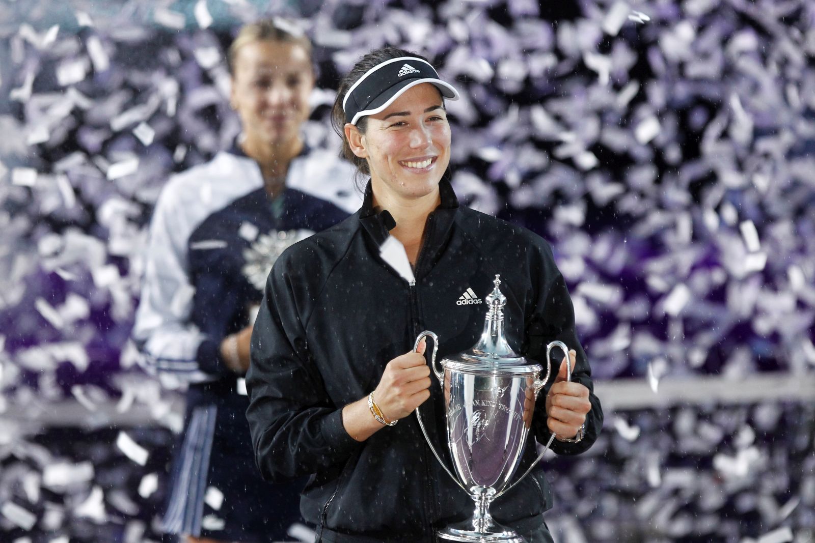 epa09588507 Garbine Muguruza of Spain celebrates during single's trophy ceremony after winning the Akron WTA Finals tennis tournament, in Guadalajara, Mexico, 17 November 2021.  EPA/Francisco Guasco
