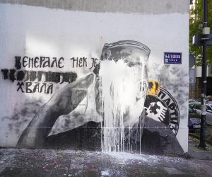 10, November, 2021, Belgrade - A bucket of lime was thrown on the mural with the image of Ratko Mladic, and behind it stands Djordjo Zujovic, a longtime activist and member of the Social Democratic Party of Serbia. Photo: Antonio Ahel/ATAImages

10, novembar, 2021, Beograd  - Na mural sa likom Ratka Mladica bacena je kofa kreca, a iza toga stoji Djordjo Zujovic, dugogodisnji aktivista i clan Socijaldemokratske partije Srbije. Photo: Antonio Ahel/ATAImages