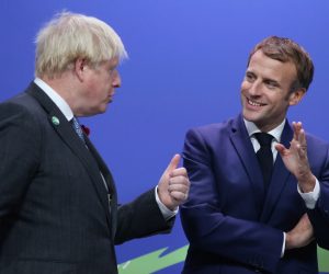 epa09557892 British Prime Minister Boris Johnson (L) greets French President Emmanuel Macron as leaders arrive for the COP26 UN Climate Summit in Glasgow, Britain 01 November 2021. The COP26 climate change conference runs from 31 October to 12 November 2021 in Glasgow.  EPA/ROBERT PERRY