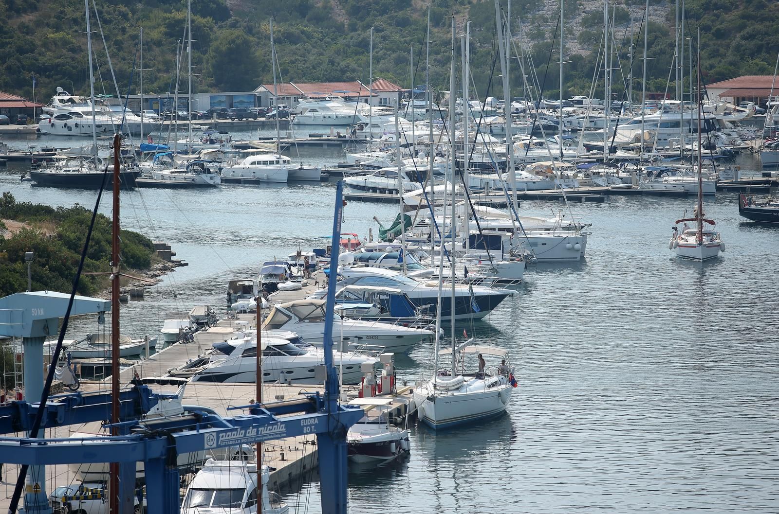 14.08.2015., Primosten - Marina Primosten. Primosten je jedno od najljepsih ljetovalista na Jadranu. Geografski polozaj Primostena i prirodne osobine njegovog obalnog pojasa nose znacajne vrijednosti. Uvale Velika i Mala Raduca, a narocito uvala Primosten (luka) isticu se izvanrednim prirodnim zaklonima.  Photo: Sanjin Strukic/PIXSELL