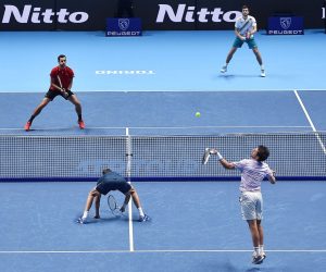 epa09585074 Marcel Granollers (front L) of Spain and Horacio Zeballos (front R) of Argentina in action against Croatian players Mate Pavic (back L) and Nikola Mektic (back R) during their doubles group stage match of the Nitto ATP Finals tennis tournament in Turin, Italy, 16 November 2021.  EPA/Alessandro Di Marco