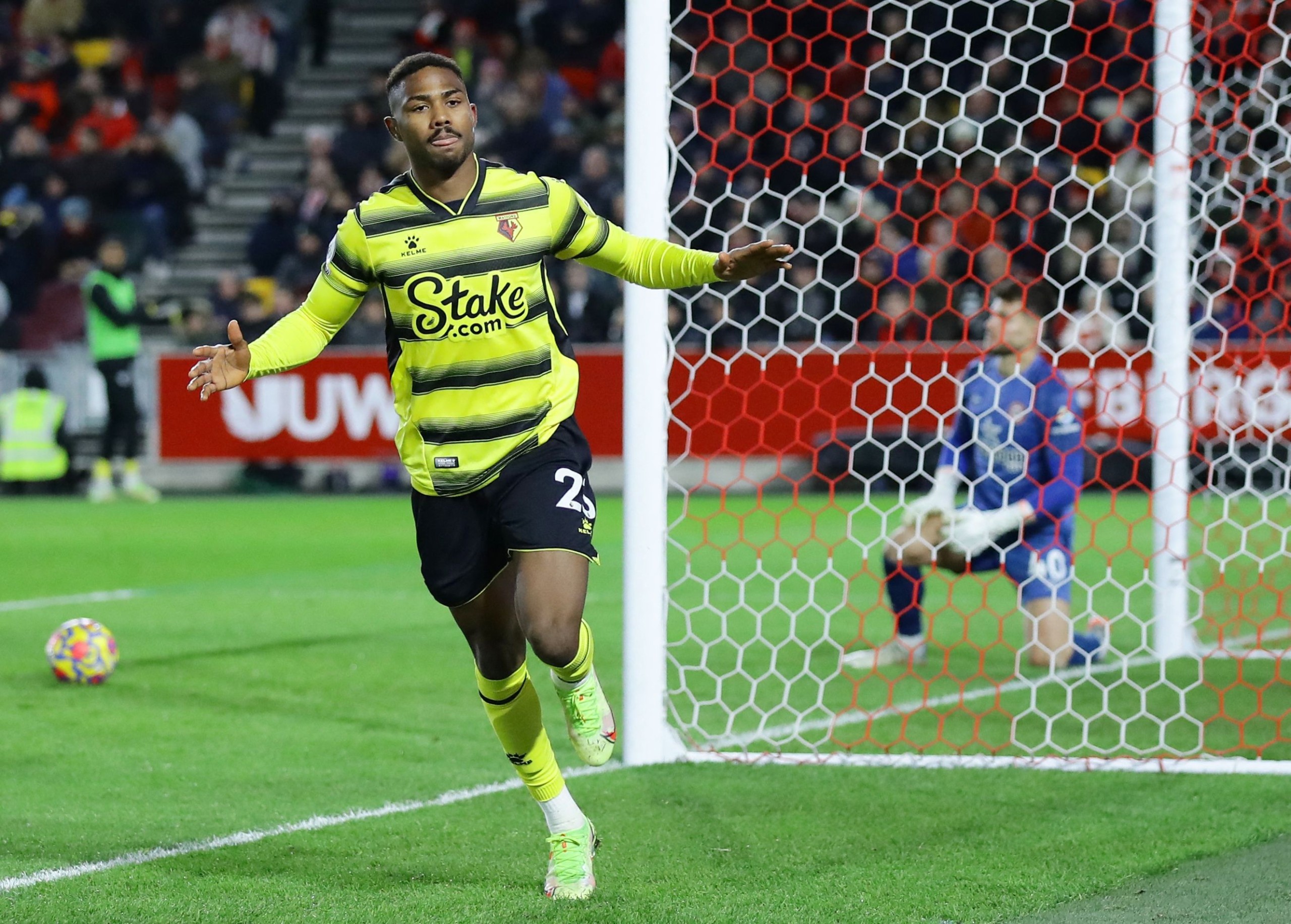 Soccer Football - Premier League - Brentford v Watford - Brentford Community Stadium, London, Britain - December 10, 2021 Watford's Emmanuel Dennis celebrates scoring their first goal REUTERS/David Klein EDITORIAL USE ONLY. No use with unauthorized audio, video, data, fixture lists, club/league logos or 'live' services. Online in-match use limited to 75 images, no video emulation. No use in betting, games or single club /league/player publications.  Please contact your account representative for further details.