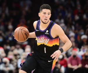 Dec 25, 2021; Phoenix, Arizona, USA; Phoenix Suns guard Devin Booker (1) dribbles against the Golden State Warriors during the first half at Footprint Center. Mandatory Credit: Joe Camporeale-USA TODAY Sports