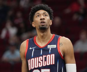 Houston Rockets center Christian Wood looms at the scoreboard during the first half of an NBA basketball game against the Orlando Magic, Friday, Dec. 3, 2021, in Houston. (AP Photo/Eric Christian Smith)