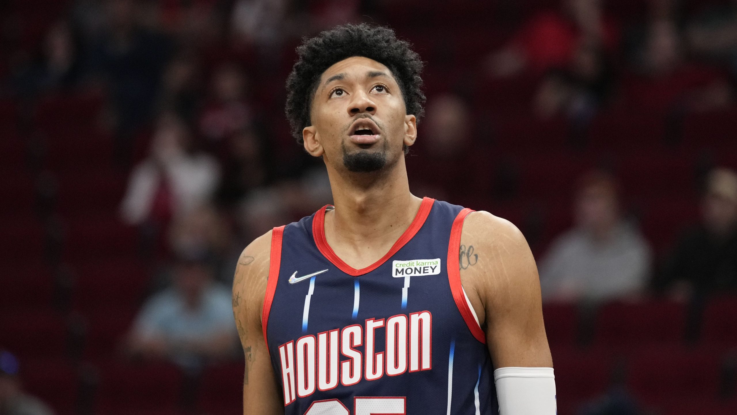 Houston Rockets center Christian Wood looms at the scoreboard during the first half of an NBA basketball game against the Orlando Magic, Friday, Dec. 3, 2021, in Houston. (AP Photo/Eric Christian Smith)