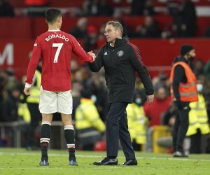 Manchester United's manager Ralf Rangnick shakes hands with Manchester United's Cristiano Ronaldo at the end of the English Premier League soccer match between Manchester United and Crystal Palace at Old Trafford stadium in Manchester, England, Sunday, Dec. 5, 2021. (AP Photo/Jon Super)