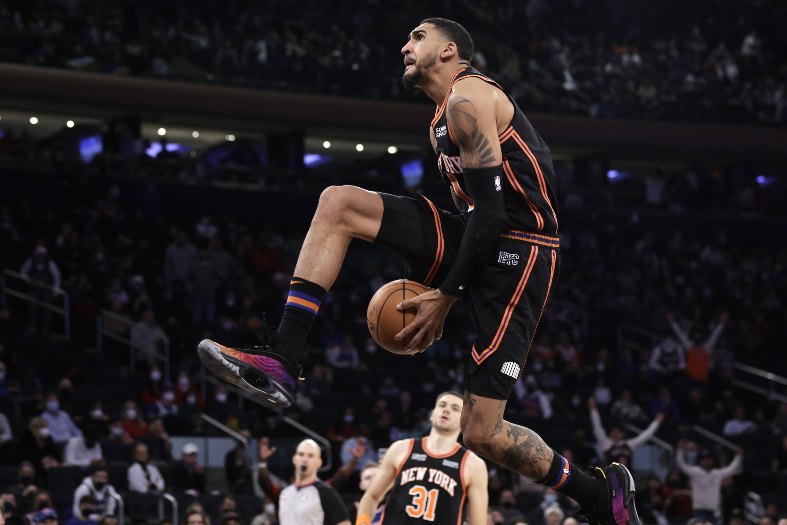 New York Knicks forward Obi Toppin drives to the basket during the second half of an NBA basketball game against the Atlanta Hawks, Saturday, Dec. 25, 2021, in New York. The Knicks won 101-87. (AP Photo/Adam Hunger)