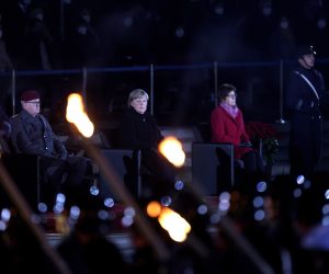 epa09617263 German Chancellor Angela Merkel (C) attends the military grand tattoo in her honor at the defense ministry in Berlin, Germany, 02 December 2021. Acting German Chancellor Angela Merkel receives on 02 December 2021, on the occasion of her farewell, a Grand Tattoo of the German Federal Armed Forces (Bundeswehr).  EPA/FILIP SINGER