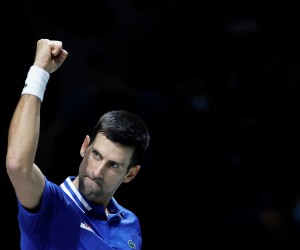 epa09619618 Novak Djokovic of Serbia celebrates winning against Marin Cilic of Croatia during their semi final Davis Cup tie between Serbia and Croatia held at Madrid Arena tennis complex in Madrid, central Spain, 03 December 2021.  EPA/Emilio Naranjo