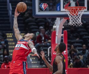epa09620003 Washington Wizards forward Kyle Kuzma (L) in action against the Cleveland Cavaliers defense during the NBA basketball game between the Cleveland Cavaliers and the Washington Wizards at Capital One Arena in Washington, DC, USA, 03 December 2021.  EPA/SHAWN THEW SHUTTERSTOCK OUT