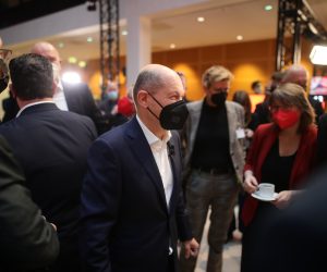 epa09620404 Germany's designated Chancellor and acting Minister of Finance Olaf Scholz (C) attends an extraordinary Social Democrats' (SPD) party conference for the new coalition treaty at the party's headquarter Willy Brandt House in Berlin, Germany, 04 December 2021.  EPA/RAINER KEUENHOF / POOL  / action press basics