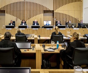 epa09629608 Prosecutors and the court including chairman Hendrik Steenhuis (3L) prior to the follow-up hearing in the Schiphol Judicial Complex for the follow-up hearing of the extensive criminal trial about the downing of flight MH17 in Badhoevedorp, the Netherlands, 08 December 2021 . Among other things, the planning and claims of injured parties are discussed during the hearing. Malaysia Airlines Flight MH-17 was shot down on 17 July 2014 while flying over eastern Ukraine, killing all 283 passengers and 15 crew on board.  EPA/SEM VAN DER WAL