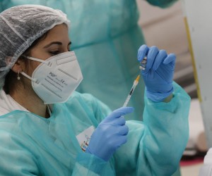 epa09643660 A health worker prepares a Pfizer Covid-19 vaccine for children at the hub of Explora Children's Museum, in Rome, Italy, 15 December 2021. The Covid-19 vaccination campaign for children between 5 and 11 years of age started in the country.  EPA/GIUSEPPE LAMI