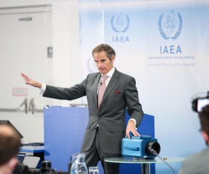 epa09646536 International Atomic Energy Agency (IAEA) Director General Rafael Mariano Grossi points at the module of a IAEA surveillance camera during a press conference at the IAEA headquarters of the UN seat in Vienna, Austria, 17 December 2021. The IAEA director general commented on the developments related to the IAEA's monitoring and verification work in the Islamic Republic of Iran.  EPA/MAX BRUCKER