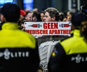 epa09648953 People protest against the Dutch government's lockdown announcement, in The Hague, the Netherlands, 18 December 2021. The Netherlands are to enter a hard lockdown starting from 19 December 2021 until at least 14 January 2022 to curb the rapid spread of the Omicron variant.  EPA/PHIL NIJHUIS