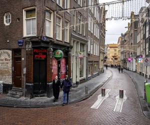 epa09649839 People walk around downtown Amsterdam during a coronavirus lockdown in the Netherlands, 19 December 2021. The Netherlands enforced a hard lockdown from 19 December 2021 until at least 14 January 2022 to curb the rapid spread of the Omicron variant of SARS-CoV-2.  EPA/Ramon van Flymen