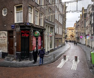 epa09649839 People walk around downtown Amsterdam during a coronavirus lockdown in the Netherlands, 19 December 2021. The Netherlands enforced a hard lockdown from 19 December 2021 until at least 14 January 2022 to curb the rapid spread of the Omicron variant of SARS-CoV-2.  EPA/Ramon van Flymen