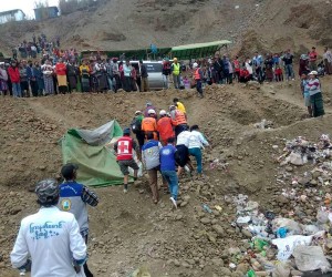 epa09653346 A handout photo made available by the Myanmar Fire Services Department shows members of fire services and rescue team search for the missing people at the accident scene of a jade mining site in Hpakant, Kachin State, northern Myanmar, 22 December 2021. According to a local rescue member from the scene, one dead body found and dozens of people missing, accident happen early in the morning.  EPA/FIRE SERVICES DEPARTMENT HANDOUT  HANDOUT EDITORIAL USE ONLY/NO SALES