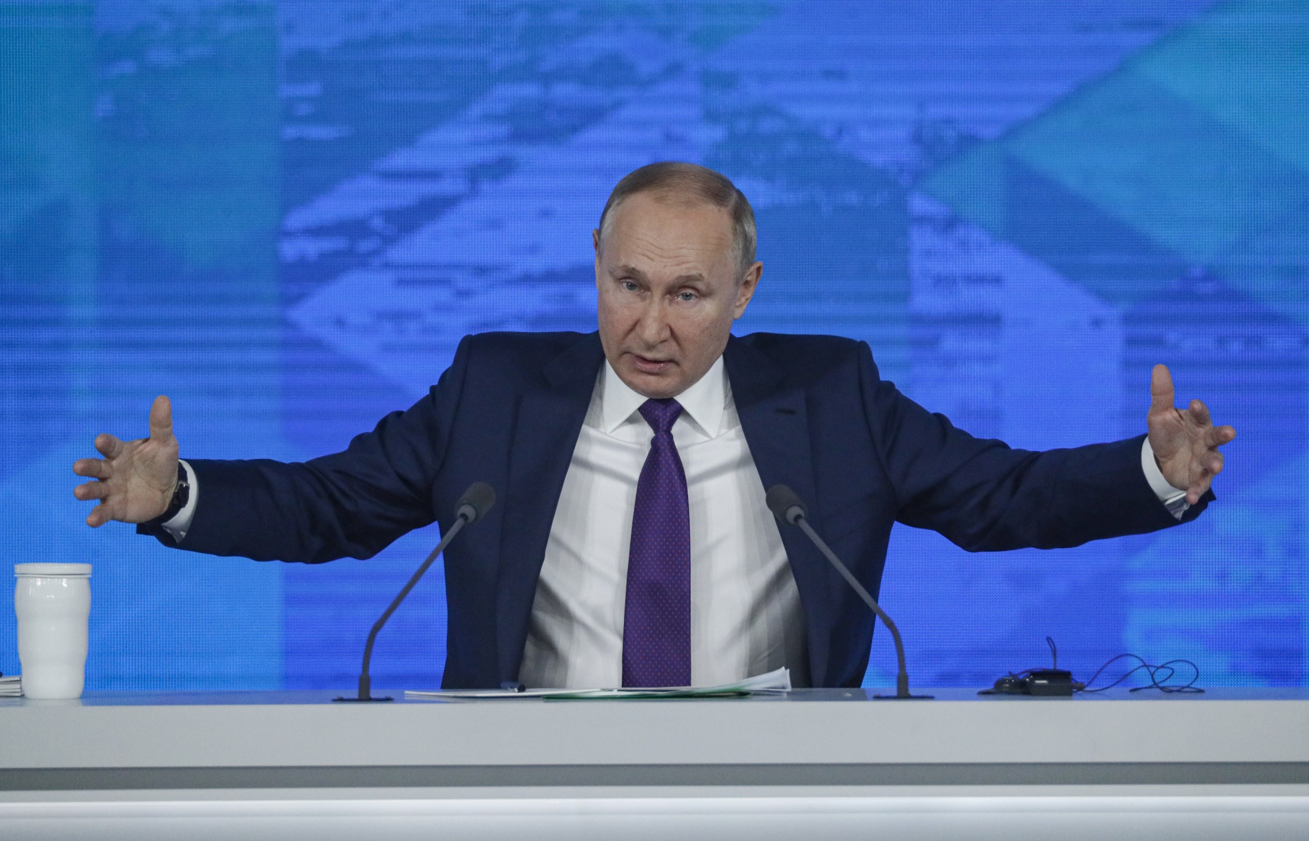 epa09654761 Russian President Vladimir Putin answers a question during his annual life-broadcasted news conference with Russian federal, regional, and foreign media at the Moscow Manege in Moscow, Russia, 23 December 2021. The President's Big Press Conference is an annual event that has been held since 2001. This year, the number of journalists was limited to 507 due to coronavirus.  EPA/YURI KOCHETKOV
