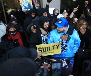 epa09655319 Damik Wright (in blue sweatshirt), Daunte Wright’s brother, reacts to the conviction of former Brooklyn Center, Minnesota, USA, police officer Kimberly Potter for the shooting death of Daunte Wright, in Minneapolis, Minnesota, USA, 23 December 2021. Potter was found guilty of first- and second-degree manslaughter for the shooting of Wright on 11 April 2021.  EPA/NIKOLAS LIEPINS