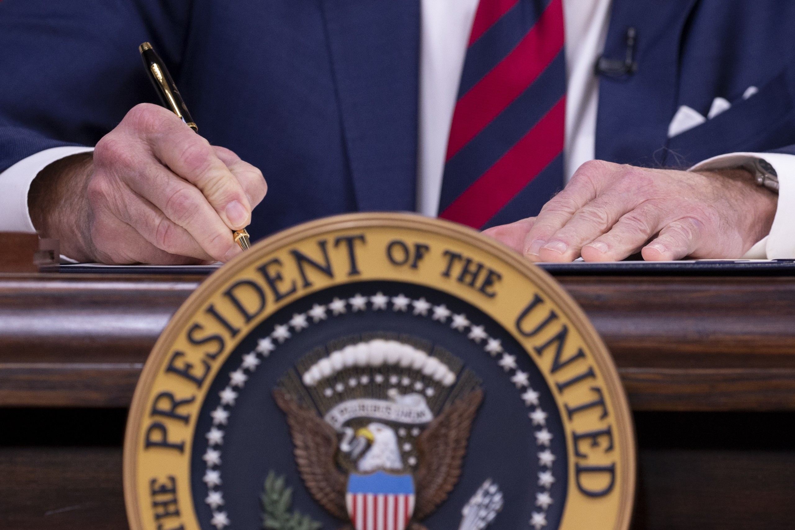epa09655297 US President Joe Biden signs into law, 'Accelerating Access to Critical Therapies for ALS Act', in the Eisenhower Executive Office Building on the White House complex in Washington, DC, USA, 23 December 2021. The law establishes grant programs to address neurodegenerative diseases, such as amyotrophic lateral sclerosis (ALS) - also known as Lou Gehrig's disease.  EPA/MICHAEL REYNOLDS