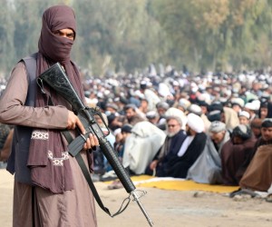 epa09656587 Taliban stand guard as Afghans gather to perform 'Istisqa' prayers, praying for rainfall as a drought has added misery to the already fragile economy of the country, in Kandahar, Afghanistan, 25 December 2021. Rain prayers, known in Arabic as Salat Al Istisqa, is a prayer observed by Muslims for asking and seeking rain from God. The World Food Program has warned that a humanitarian crisis of incredible proportions has grown even more complex and severe since the Taliban took control, and that 22.8 million Afghans – or more than half the population – are not consuming enough food.  EPA/STRINGER