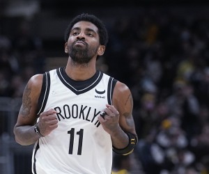 Brooklyn Nets' Kyrie Irving reacts after hitting a shot during the second half of the team's NBA basketball game against the Indiana Pacers, Wednesday, Jan. 5, 2022, in Indianapolis. (AP Photo/Darron Cummings)