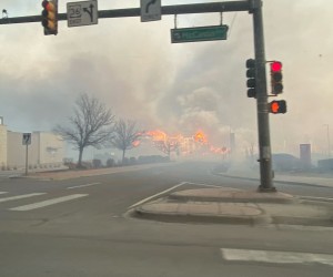 epa09661069 A handout photo made available by the Broomfield Police Department and taken by a patrol officers shows smoke and flames seen from McCaslin Blvd east of US 36 in Superior, Boulder County, Colorado, USA, 30 December 2021. Fast-moving wildfires, the Marshall and Middle Fork fires, on 30 December forced the evacuation of thousands of people in the towns of Louisville and Superior in Boulder County, Colorado. 'The fire activity is constantly changing and highly impacted by the weather,' the Boulder Office of Emergency Management (OEM) said in a statement.  EPA/BROOMFIELD POLICE DEPARTMENT HANDOUT -- BEST QUALITY AVAILABLE -- HANDOUT EDITORIAL USE ONLY/NO SALES