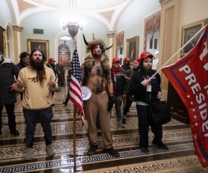 epa09664285 (14/24) (FILE) - Supporters of US President Trump stand by the door to the Senate chambers after they breached the US Capitol security in Washington, DC, USA, 06 January 2021 (reissued 03 January 2021). Following the November 2020 US presidential election, a tone set by supporters of defeated US President Donald Trump escalated further. Trump, who was refusing to concede the victory of Joe Biden, claiming voter fraud and rigged elections, told supporters and white nationalist extreme-right group Proud Boys to respectively 'Stop the Steal' and to 'stand back and stand by'. His social media accounts were suspended and the alt-right platform Parler gained in user numbers. 
 
On 06 January 2021, incumbent US vice president Pence was due to certify the Electoral College votes before Congress, the last step in the process before President-elect Biden was to be sworn in. In the morning, pro-Trump protesters had gathered for the so-called Save America March. Soon after Trump finished his speech at the Ellipse, the crowd marched to the Capitol. The attack had begun. 
 
Rioters broke into the Capitol building where the joint Congress session was being held. Lawmakers barricaded themselves inside the chambers and donned tear gas masks while rioters vandalized the building, some even occupying offices such as House Speaker Pelosi's. Eventually in the evening the building was cleared from insurrectionists, and the Congress chambers reconvened their session, confirming Joe Biden as the winner of the 2020 US presidential election. 

In the aftermath, more than 600 people were charged with federal crimes in connection to the insurgency, and close Trump aides such as Steve Bannon, Mark Meadows and Roger Stone were subpoenaed by the House select committee investigating the attack. Trump himself was acquitted by the Senate in his second impeachment trial, this time for "inciting an insurrection".  EPA/JIM LO SCALZO  ATTENTION: This Image is part of a PHOTO SET *** Loc