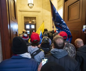 epa09664283 (12/24) (FILE) - Supporters of US President Trump stand by the door of the Eastern front after they breached the US Capitol security in Washington, DC, USA, 06 January 2021 (reissued 03 January 2021). Following the November 2020 US presidential election, a tone set by supporters of defeated US President Donald Trump escalated further. Trump, who was refusing to concede the victory of Joe Biden, claiming voter fraud and rigged elections, told supporters and white nationalist extreme-right group Proud Boys to respectively 'Stop the Steal' and to 'stand back and stand by'. His social media accounts were suspended and the alt-right platform Parler gained in user numbers. 
 
On 06 January 2021, incumbent US vice president Pence was due to certify the Electoral College votes before Congress, the last step in the process before President-elect Biden was to be sworn in. In the morning, pro-Trump protesters had gathered for the so-called Save America March. Soon after Trump finished his speech at the Ellipse, the crowd marched to the Capitol. The attack had begun. 
 
Rioters broke into the Capitol building where the joint Congress session was being held. Lawmakers barricaded themselves inside the chambers and donned tear gas masks while rioters vandalized the building, some even occupying offices such as House Speaker Pelosi's. Eventually in the evening the building was cleared from insurrectionists, and the Congress chambers reconvened their session, confirming Joe Biden as the winner of the 2020 US presidential election. 

In the aftermath, more than 600 people were charged with federal crimes in connection to the insurgency, and close Trump aides such as Steve Bannon, Mark Meadows and Roger Stone were subpoenaed by the House select committee investigating the attack. Trump himself was acquitted by the Senate in his second impeachment trial, this time for "inciting an insurrection".  EPA/JIM LO SCALZO  ATTENTION: This Image is part of a PHOTO SET *** Local