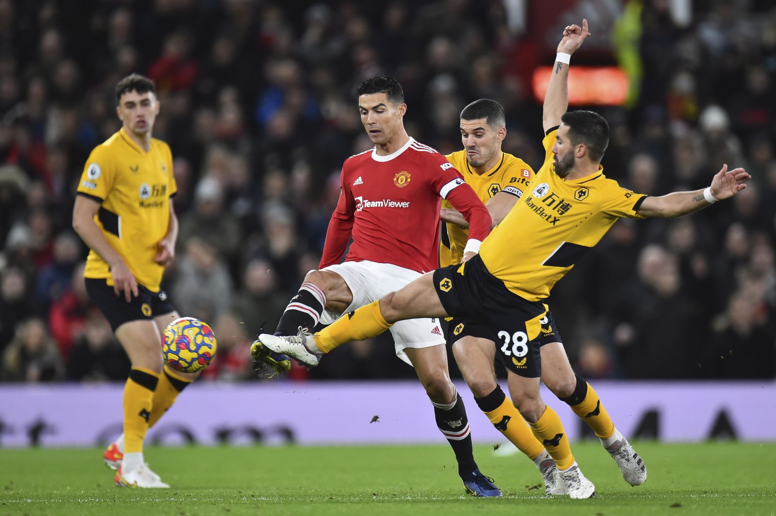 epa09664951 Manchester United's Cristiano Ronaldo (2-L) in action against Wolverhampton's Joao Moutinho (R) during the English Premier League match between Manchester United and Wolverhampton Wanderers in Manchester, Britain, 03 January 2022.  EPA/PETER POWELL EDITORIAL USE ONLY. No use with unauthorized audio, video, data, fixture lists, club/league logos or 'live' services. Online in-match use limited to 120 images, no video emulation. No use in betting, games or single club/league/player publications