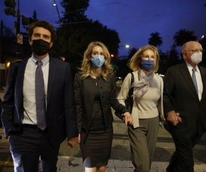 epa09665287 Elizabeth Holmes (2-L), founder of Theranos, her partner, Billy Evans (L), her mother Noel (2-R) and her father Christian (R) depart the Robert F. Peckham Federal Building and US Courthouse after being found guilty on four counts and acquitted on four counts in San Jose, California, USA, 03 January 2022. The jury also deadlocked on three other charges against CEO Elizabeth Holmes, and Theranos, her failed blood-testing technology start-up company.  EPA/PETER DASILVA