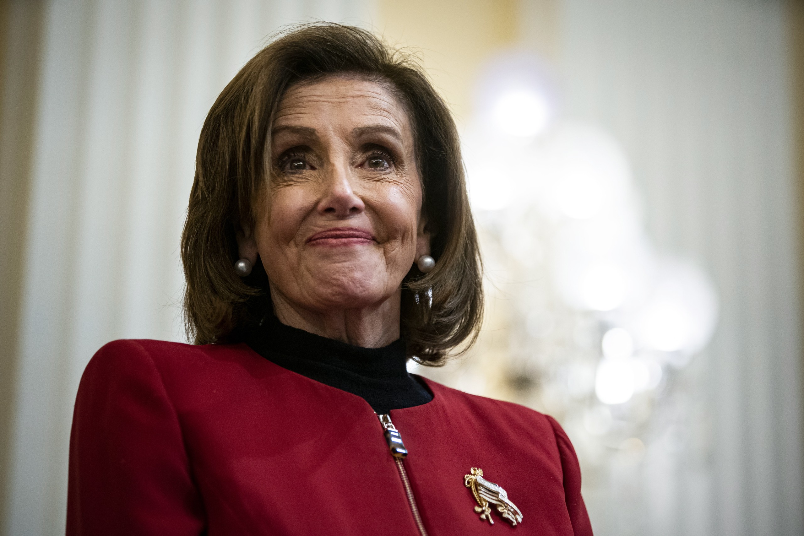 epa09670514 House Speaker Nancy Pelosi (D-Calif.) listens to a video with the cast of Hamilton the musical, during a discussion with historians Goodwin and Jon Meacham, on Capitol Hill in Washington, DC, USA, on 06 January, 2022, on how 'to establish and preserve the narrative of January 6th.'  EPA/Al Drago / POOL