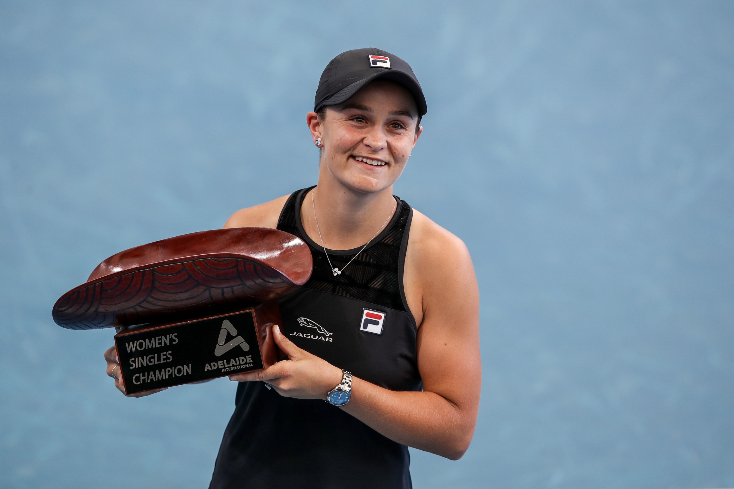 epa09674704 Ash Barty of Australia celebrates victory with the trophy during her match against Elena  Rybakina of Kazakhstan in the Final of the Adelaide International Tennis Tournament, at Memorial Drive, in Adelaide, Australia, 09 January 2022.  EPA/MATT TURNER EDITORIAL USE ONLY AUSTRALIA AND NEW ZEALAND OUT