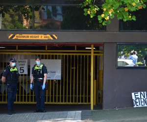 epa09676419 Victorian Police officers stand guard outside of the Park hotel government immigration facility in Melbourne, Australia, 10 January 2022. World number one ranked tennis player Novak Djokovic remains in immigration detention as he awaits the outcome of his court challenge against deportation.  EPA/JAMES ROSS  AUSTRALIA AND NEW ZEALAND OUT