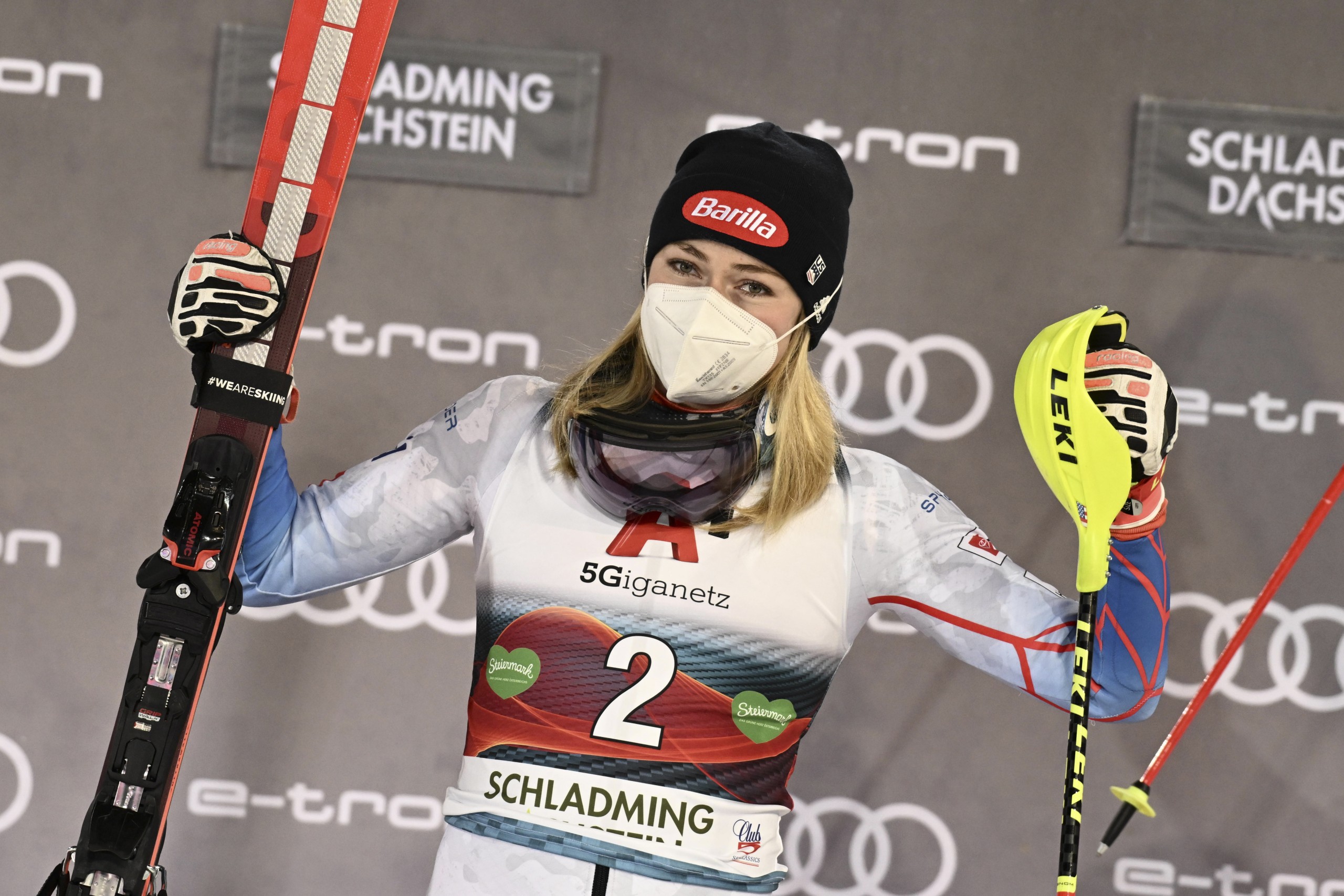 epa09679414 Winner Mikaela Shiffrin of the USA reacts on the podium after the women's Slalom race of the FIS Alpine Skiing World Cup event in Schladming, Austria, 11 January 2022.  EPA/CHRISTIAN BRUNA