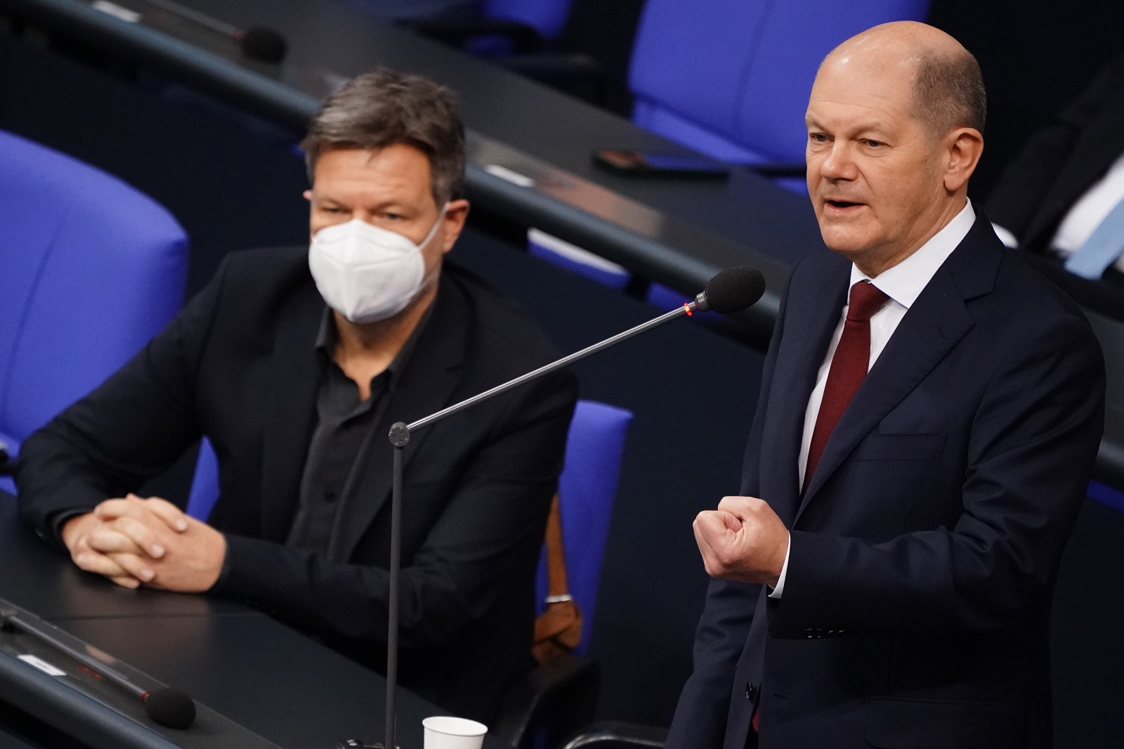epa09680282 German Chancellor Olaf Scholz (R) answers questions next to German Minister for Economy and Climate Robert Habeck during a government consultation at the German parliament Bundestag in Berlin, Germany, 12 January 2022. On a regular basis, the German Chancellor is giving answers to questions of Members of Parliament at the German Bundestag. This time it is Olaf Scholz's first scheduled government consultation.  EPA/CLEMENS BILAN