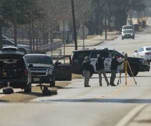 epa09689876 Law enforcement personnel continue the investigation to the hostage incident at Congregation Beth Israel Synagogue in Colleyville, Texas, USA, 16 January 2022. Four hostages were held by a gunman for ten hours in Congregation Beth Israel Synagogue on 15 January 2022 before the gunman was killed. The gunman was later identified as Malik Faisal Akram, a British citizen.  EPA/RALPH LAUER