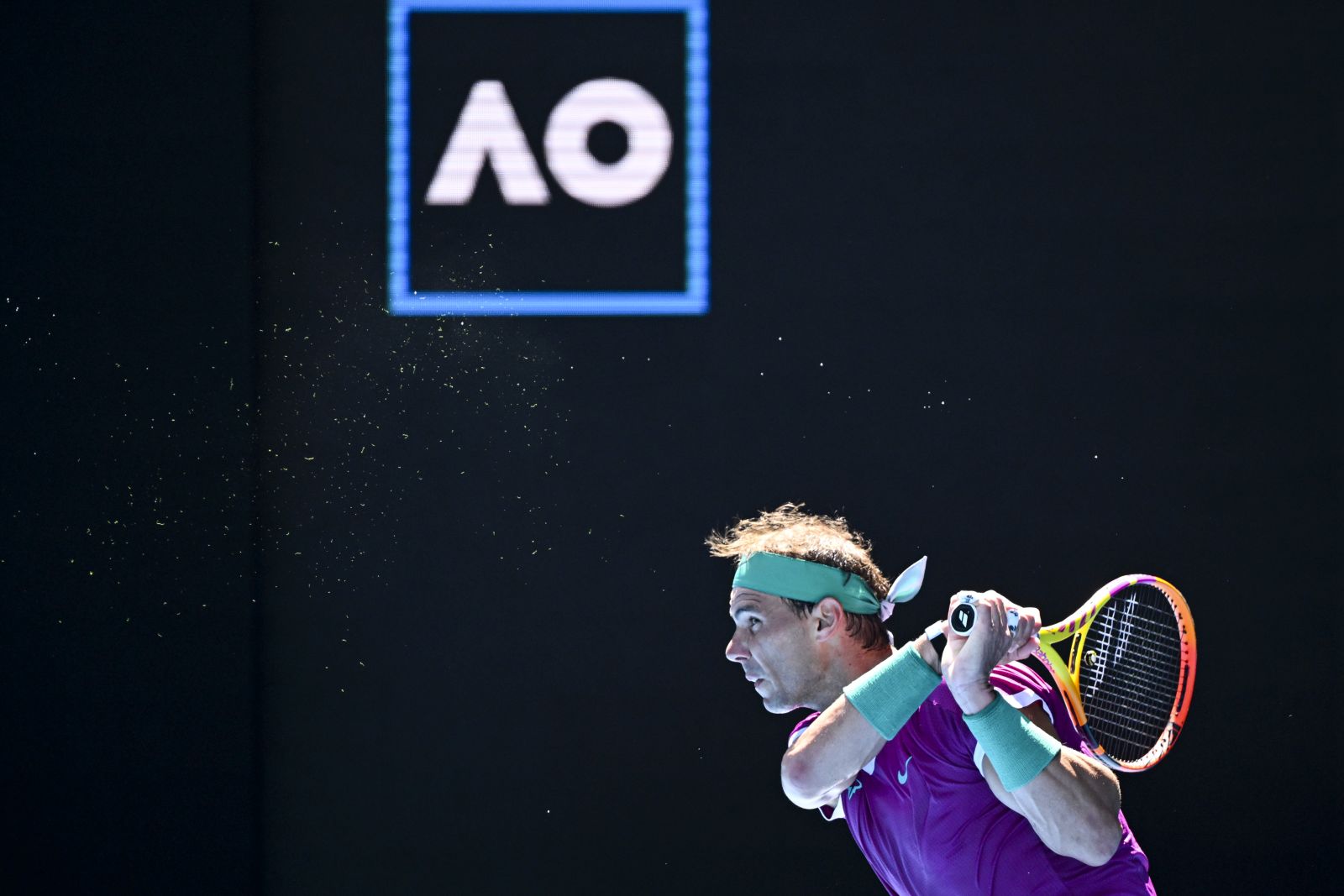 epa09690456 Rafael Nadal of Spain returns to Marcos Giron of the United States in their first round match on Day 1 of the Australian Open tennis tournament, at Melbourne Park, in Melbourne, Australia, 17 January 2022.  EPA/DAVE HUNT AUSTRALIA AND NEW ZEALAND OUT