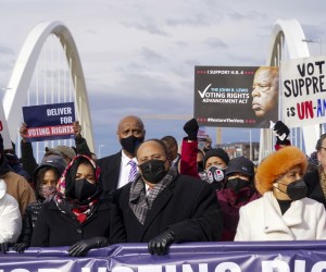 epa09691436 Martin Luther King III (C) and his family lead people on the MLK Holiday Peace Walk across the Frederick Douglass Memorial Bridge in Washington, DC, USA, 17 January 2022.  EPA/SHAWN THEW