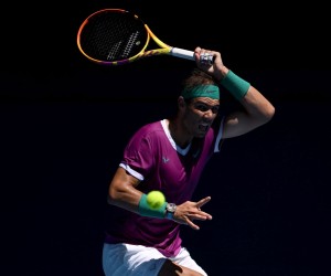 epa09694189 Rafael Nadal of Spain returns to Yannick Hanfmann of Germany in their second round match during the Australian Open tennis tournament, at Melbourne Park, in Melbourne, Australia, 19 January 2022.  EPA/DAVE HUNT AUSTRALIA AND NEW ZEALAND OUT