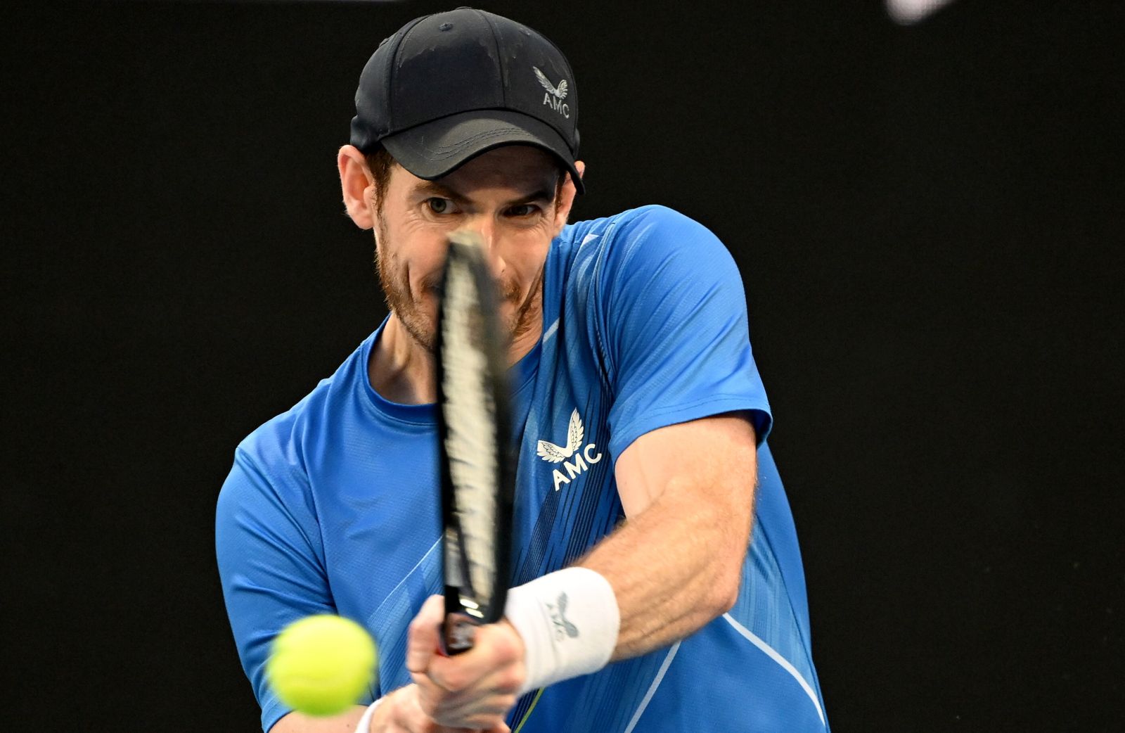 epa09696629 Andy Murray of Britain plays a shot during his second round Men’s singles match against Taro Daniel of Japan on day 4 of the Australian Open Tennis Tournament at Melbourne Park in Melbourne, Australia, 20 January 2022.  EPA/DAVE HUNT  AUSTRALIA AND NEW ZEALAND OUT