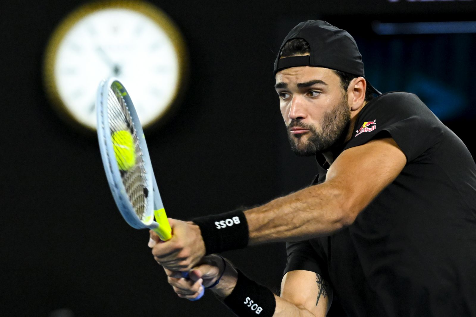 epa09703905 Matteo Berrettini of Italy in action against Pablo Carreno Busta of Spain during their 4th round match on Day 7 of the Australian Open at Melbourne Park in Melbourne, Australia, 23 January 2022.  EPA/DEAN LEWINS AUSTRALIA AND NEW ZEALAND OUT