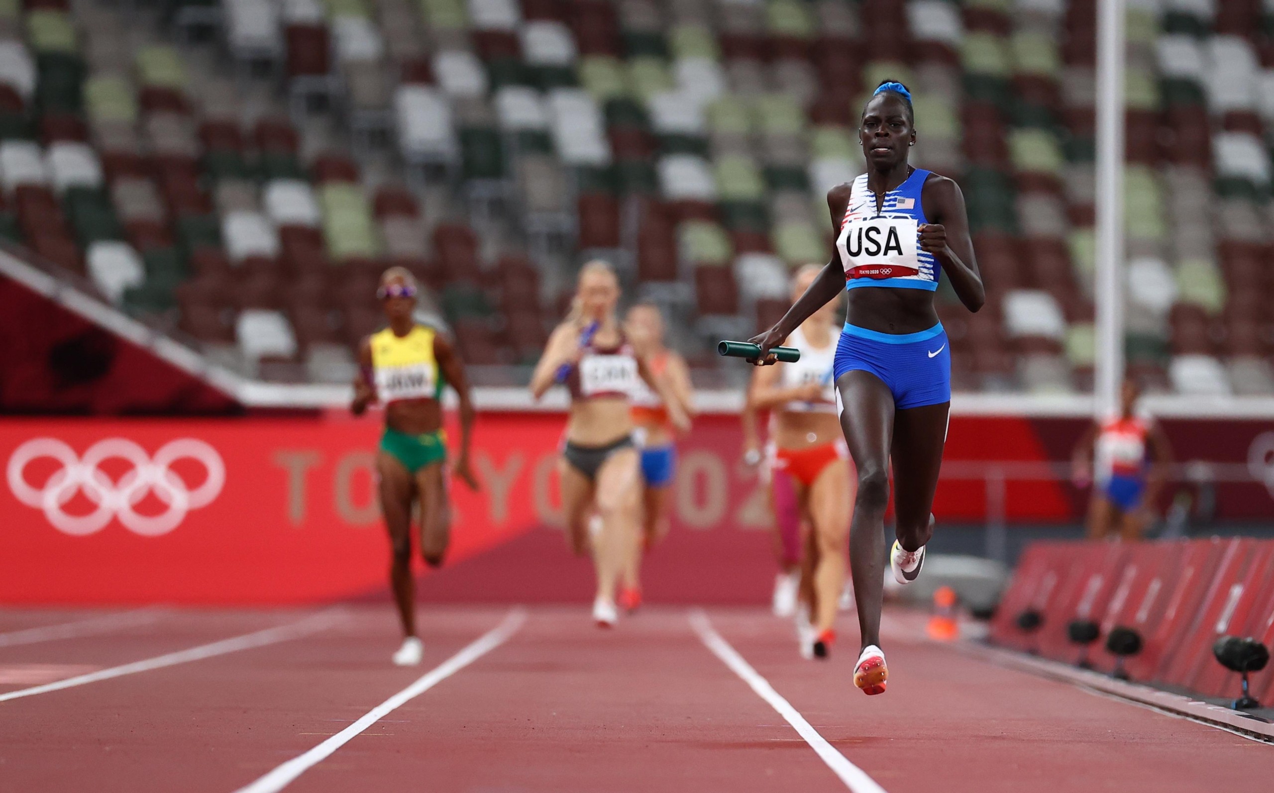 Athletics - Women's 4 x 400m Relay - Final Tokyo 2020 Olympics - Athletics - Women's 4 x 400m Relay - Final - Olympic Stadium, Tokyo, Japan - August 7, 2021. Athing Mu of the United States in action on her way to winning gold REUTERS/Lucy Nicholson LUCY NICHOLSON