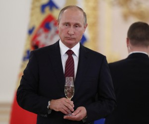 FILE PHOTO: Russian President Vladimir Putin holds a glass of champagne during a ceremony to receive credentials from foreign ambassadors at the Kremlin in Moscow, Russia October 3, 2017. REUTERS/Pavel Golovkin/Pool/File Photo Photo: POOL/REUTERS