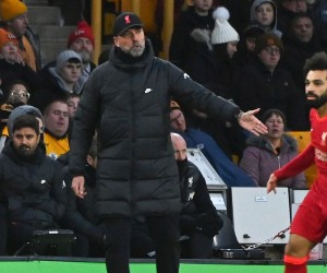 epa09621386 Liverpool manager Juergen Klopp (L) reacts during the English Premier League soccer match between Wolverhampton Wanderers and Liverpool FC in Wolverhampton, Britain, 04 December 2021.  EPA/VICKIE FLORES EDITORIAL USE ONLY. No use with unauthorized audio, video, data, fixture lists, club/league logos or 'live' services. Online in-match use limited to 120 images, no video emulation. No use in betting, games or single club/league/player publications