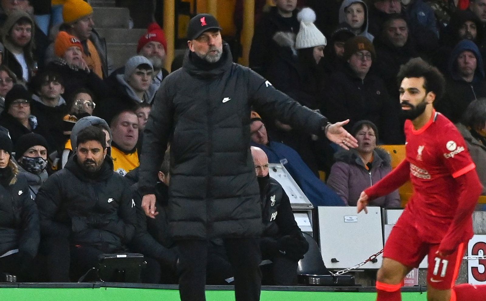 epa09621386 Liverpool manager Juergen Klopp (L) reacts during the English Premier League soccer match between Wolverhampton Wanderers and Liverpool FC in Wolverhampton, Britain, 04 December 2021.  EPA/VICKIE FLORES EDITORIAL USE ONLY. No use with unauthorized audio, video, data, fixture lists, club/league logos or 'live' services. Online in-match use limited to 120 images, no video emulation. No use in betting, games or single club/league/player publications
