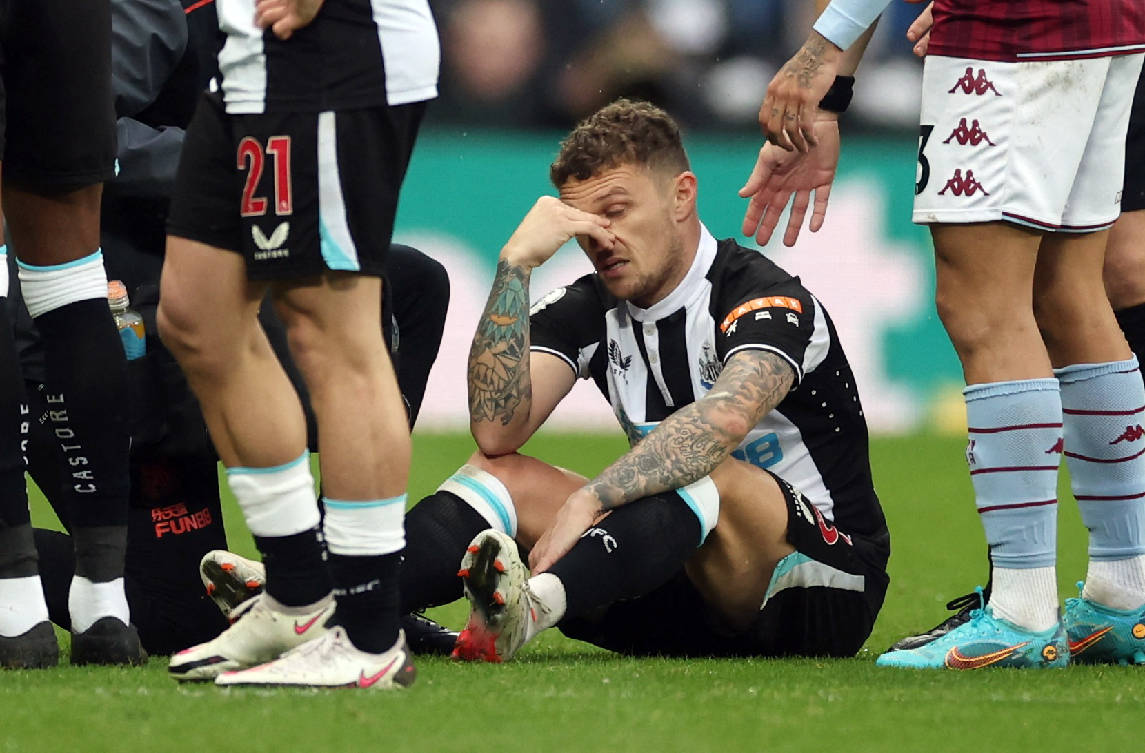 Soccer Football - Premier League - Newcastle United v Aston Villa - St James' Park, Newcastle, Britain - February 13, 2022 Newcastle United's Kieran Trippier receives medical attention after sustaining an injury Action Images via Reuters/Lee Smith EDITORIAL USE ONLY. No use with unauthorized audio, video, data, fixture lists, club/league logos or 'live' services. Online in-match use limited to 75 images, no video emulation. No use in betting, games or single club /league/player publications.  Please contact your account representative for further details.